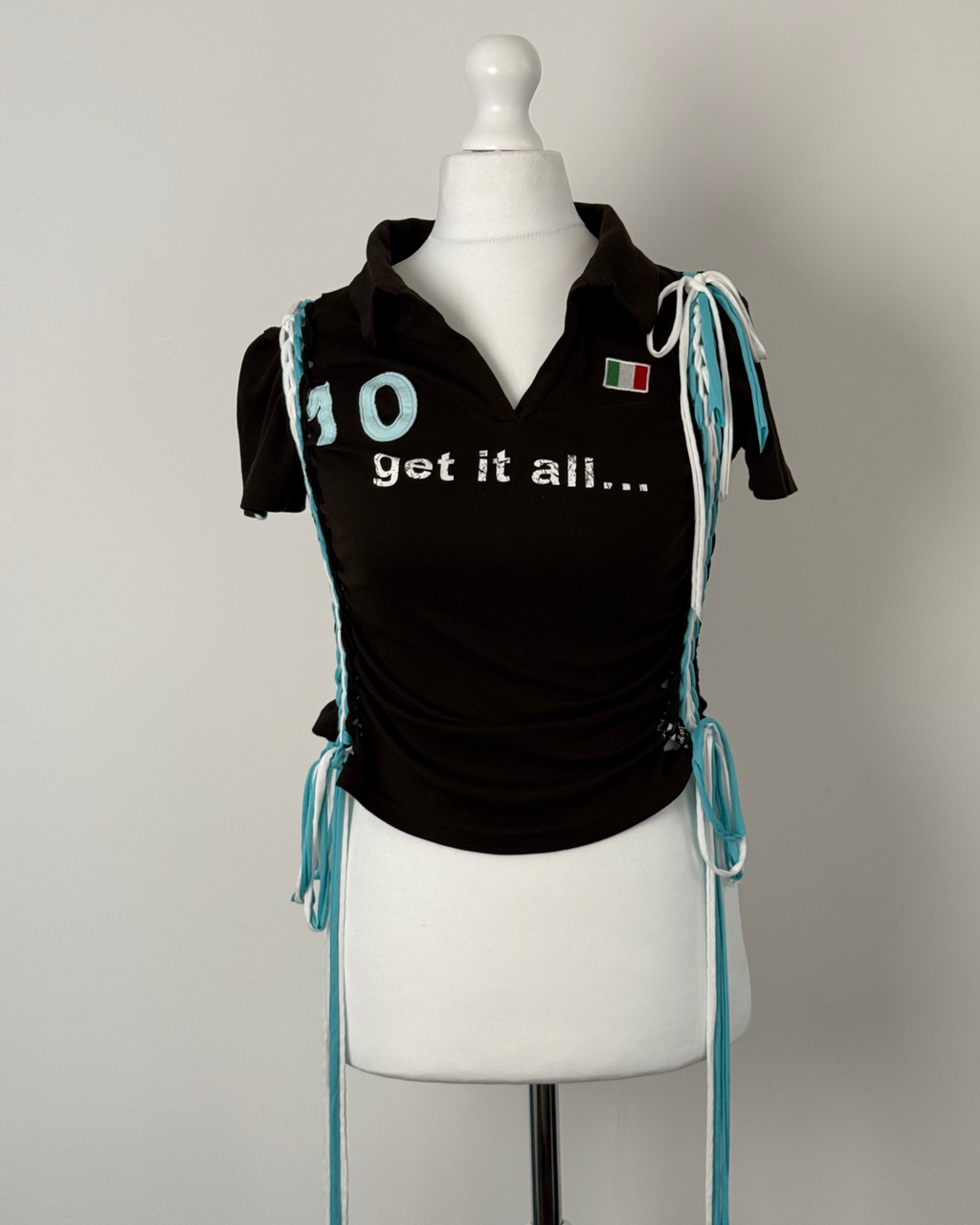 Black "kick the ball" Laddered Lace Polo