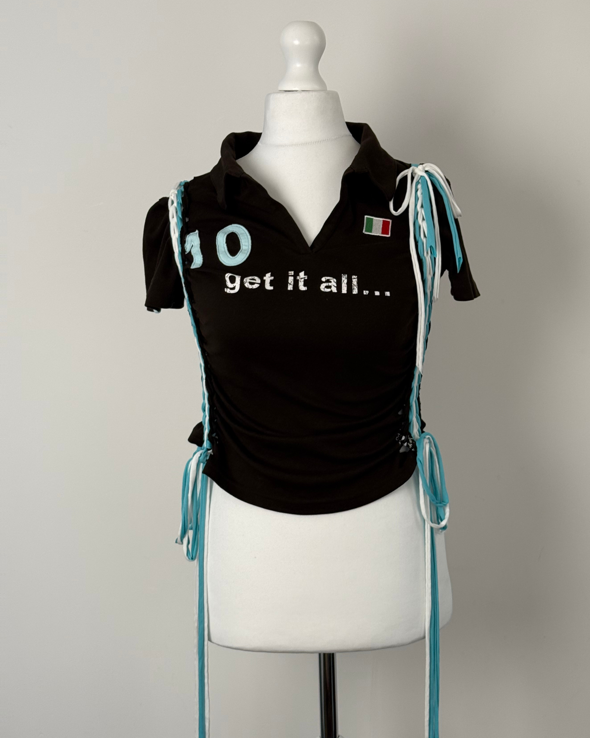 Black "kick the ball" Laddered Lace Polo