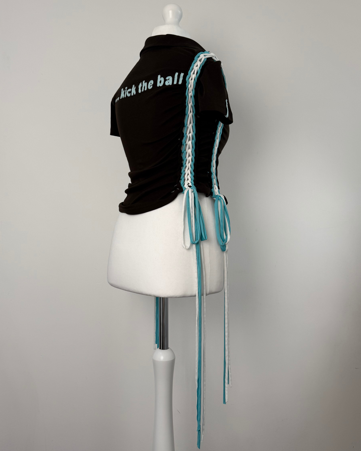 Black "kick the ball" Laddered Lace Polo