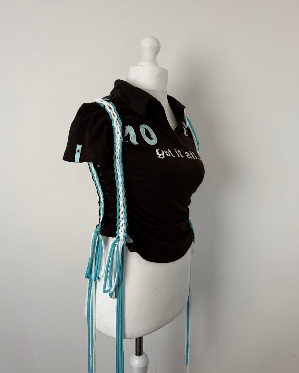 Black "kick the ball" Laddered Lace Polo