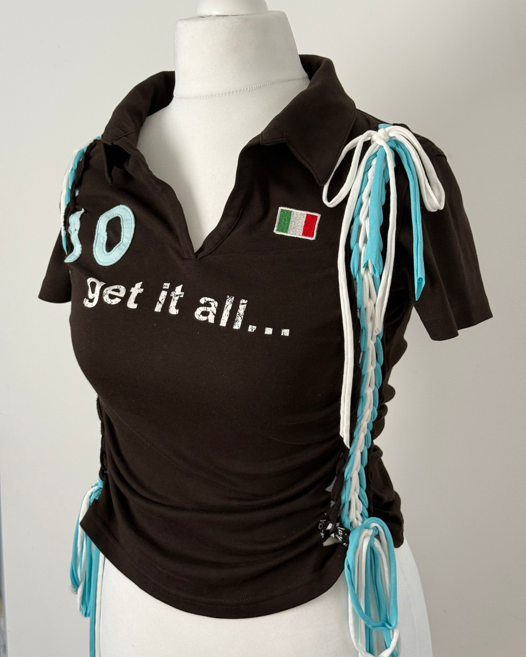 Black "kick the ball" Laddered Lace Polo