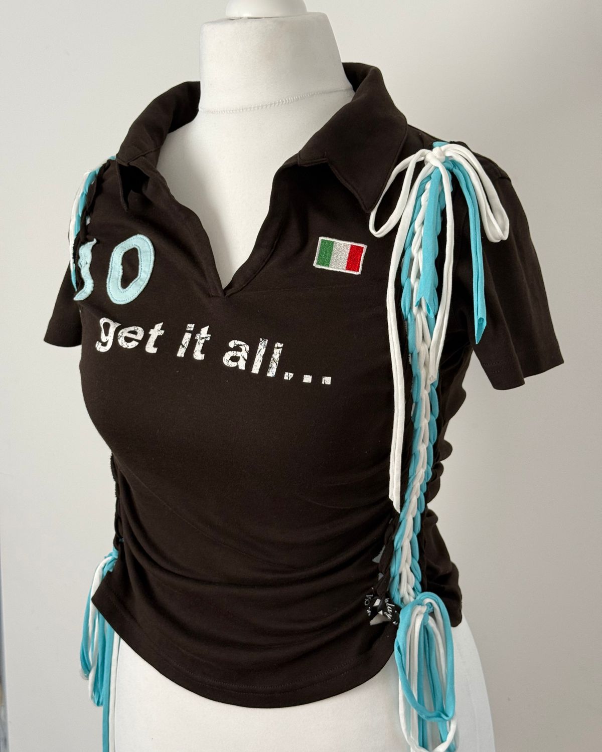 Black "kick the ball" Laddered Lace Polo