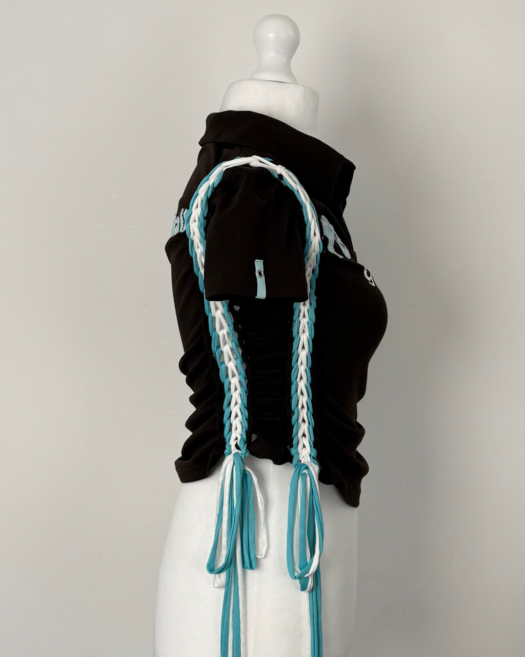 Black "kick the ball" Laddered Lace Polo