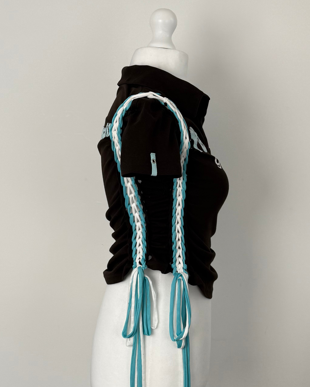 Black "kick the ball" Laddered Lace Polo