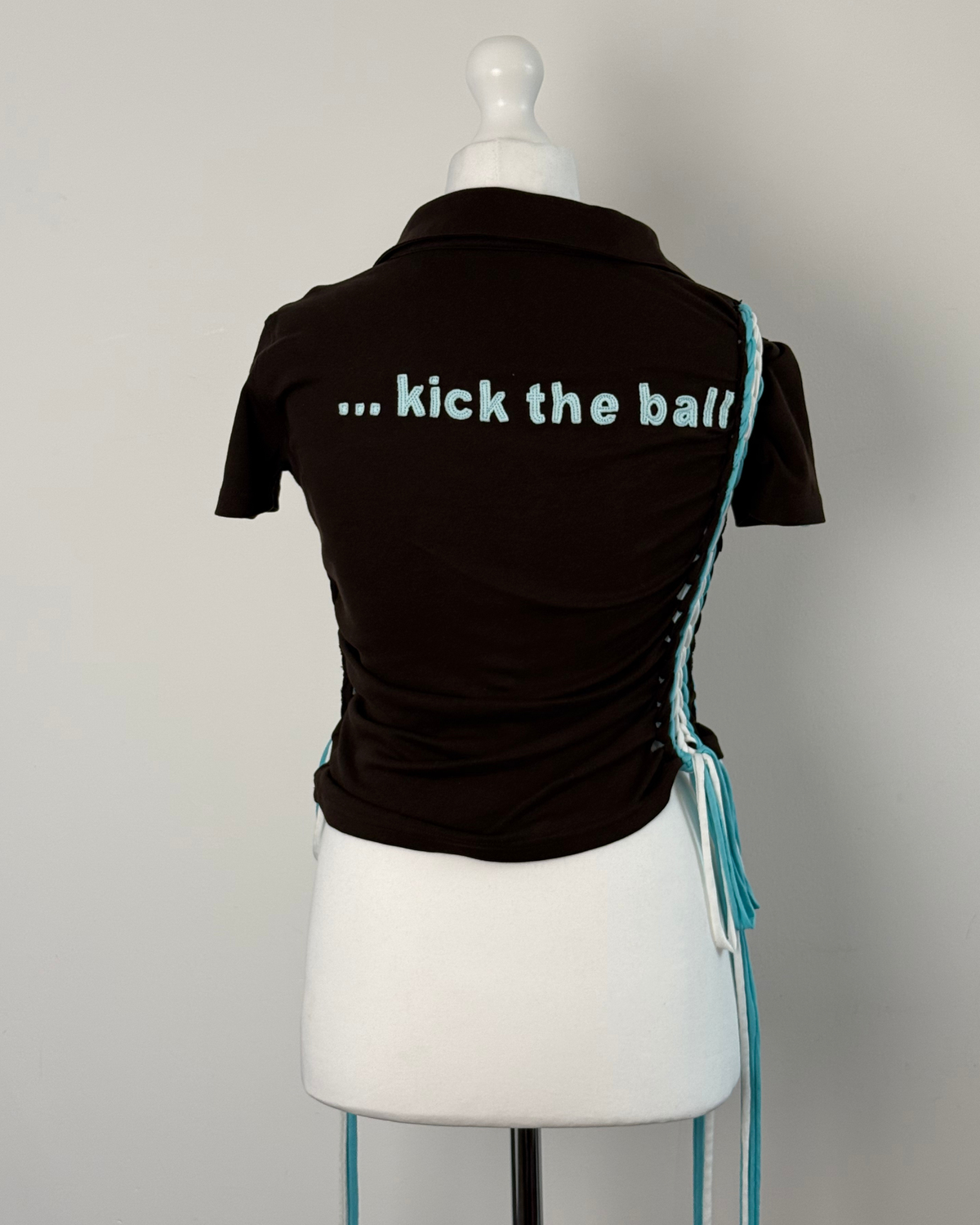 Black "kick the ball" Laddered Lace Polo