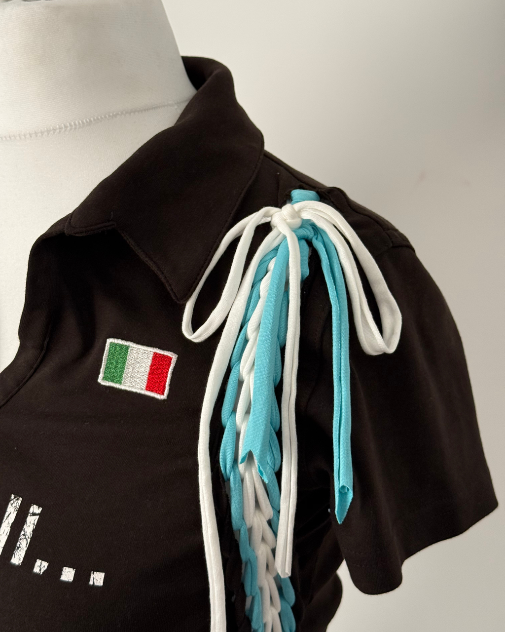 Black "kick the ball" Laddered Lace Polo