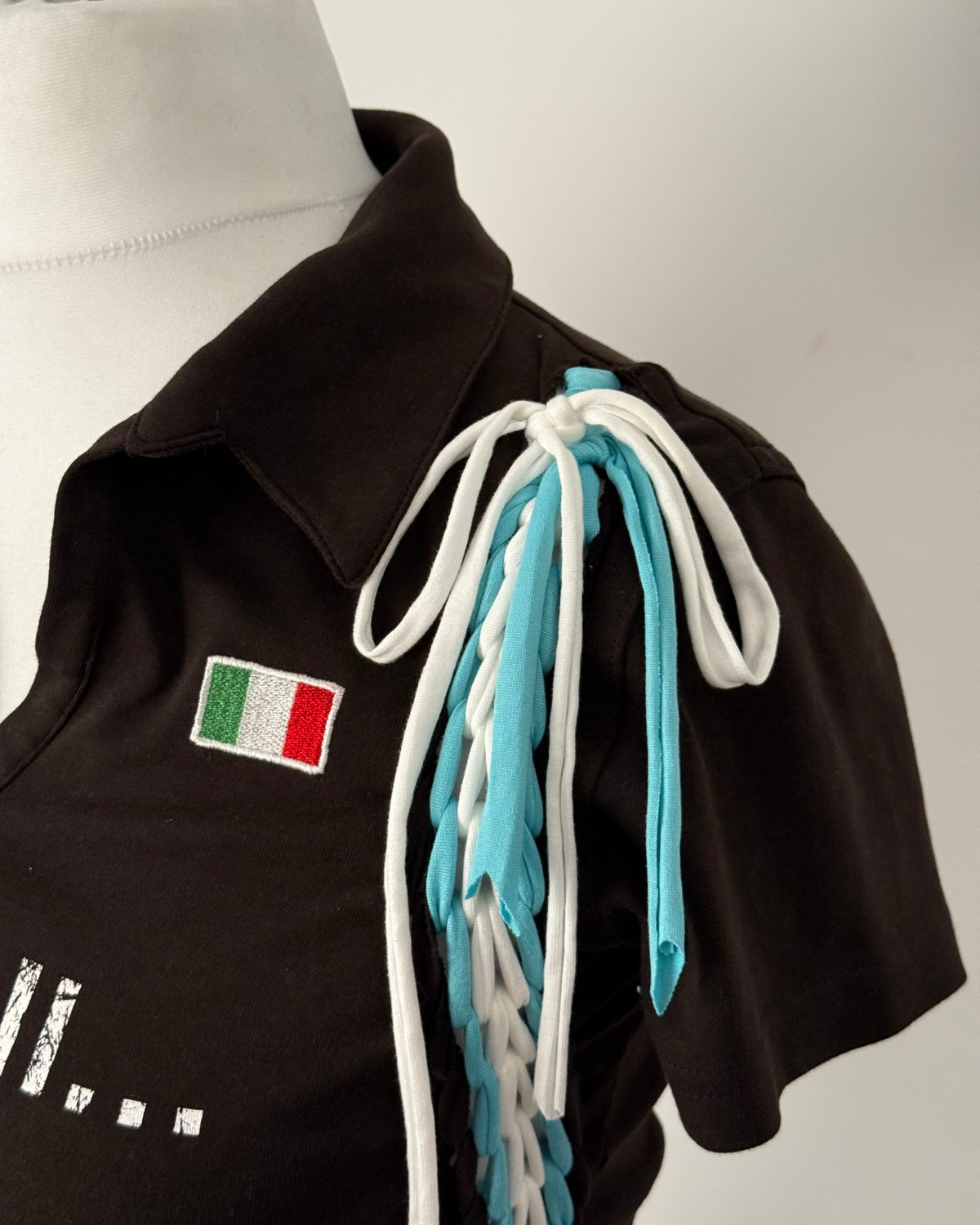 Black "kick the ball" Laddered Lace Polo