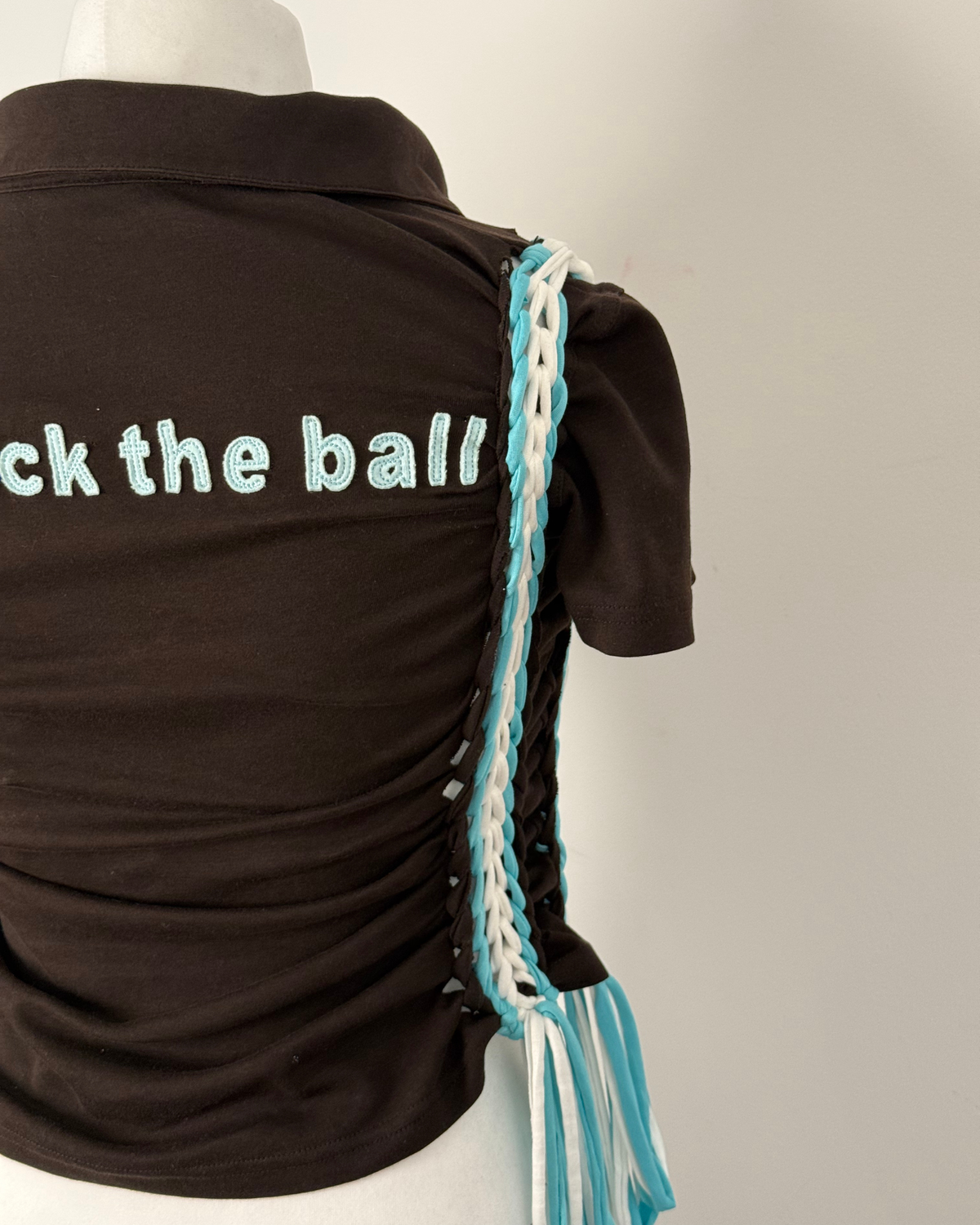Black "kick the ball" Laddered Lace Polo